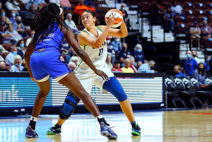 Natalie Achonwa holds a basketball